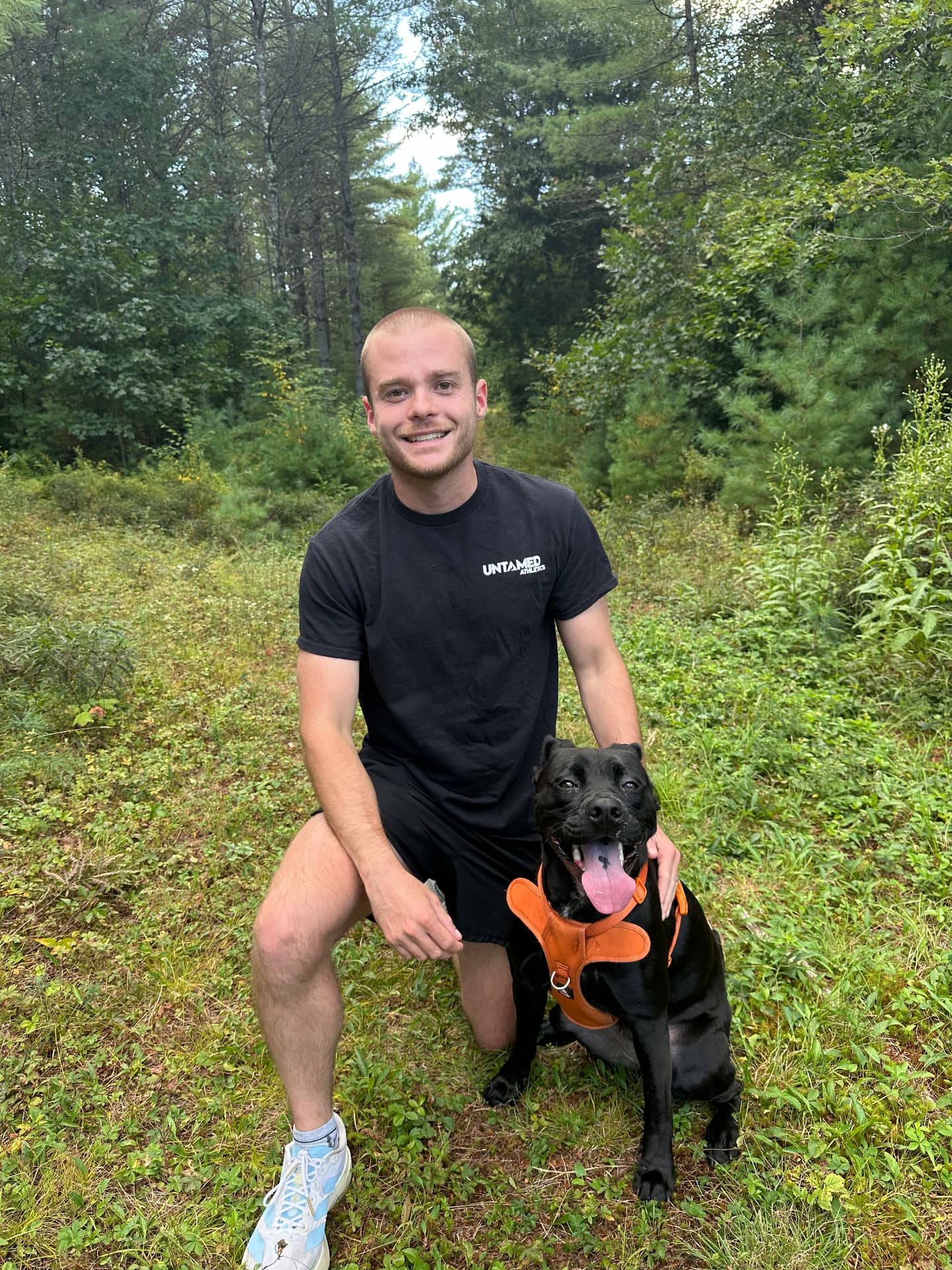 Andrew, running coach, with his dog on a forest trail